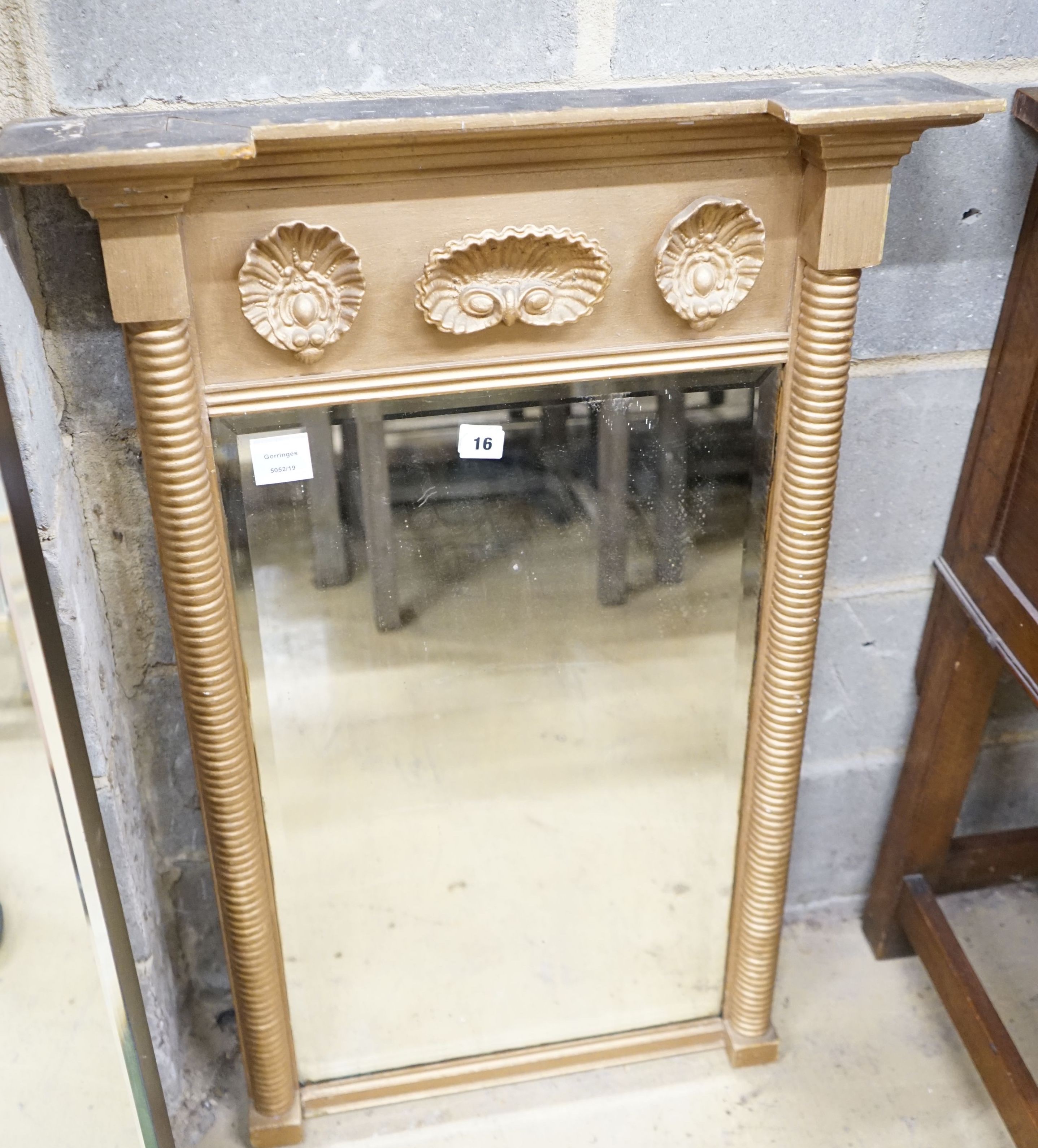 A Regency giltwood and gesso shell-moulded pier glass, width 60cm, height 94cm
